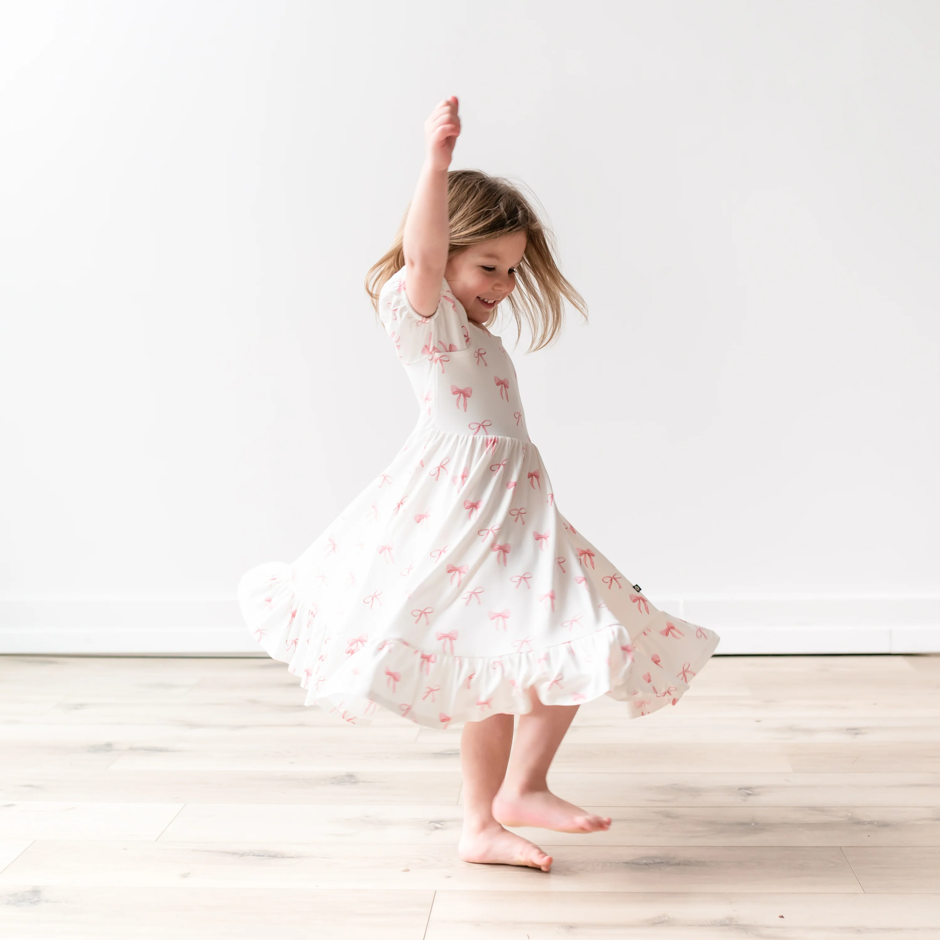 Puff Sleeve Twirl Dress in Bow - Image 3